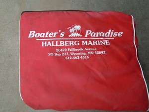 Qty of 6 life vests in carrier. New. As shown.