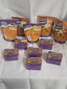 Assorted packages of Kinetic Sand (Peach & Standard scented)