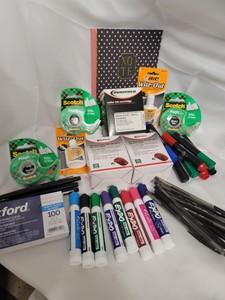 Notebook, white out, assorted pens, markers and misc office supplies