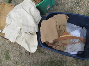 Covered Tote containing a variety of mens size clothing