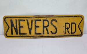 Vintage Embossed Metal NEVERS RD Road Sign