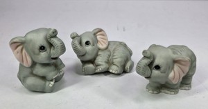 Vintage Elephant Figurines with Raised Trunks