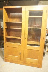 vintage home made cabinet with 1 large door with glass, 1 small lower door all compartments have adjustable shelves 56 x 12 12 x 87 12
