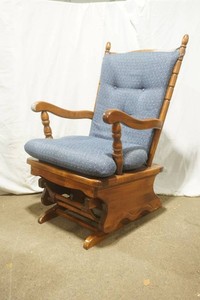glider rocker with blue cushion and back rest