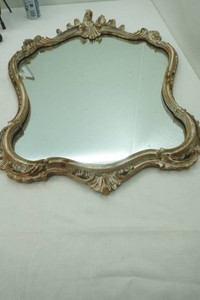 ornate vintage Rococo-style wall mirror with elaborate carved gold and antiqued scroll frame 34 x 23