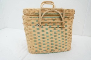 vintage woven basket filled with sewing supplies