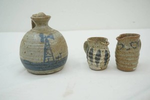 3 pieces of Tokhiem pottery 2 small pitchers and a bud vase