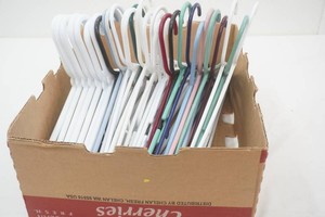 large group of plastic clothes hangers