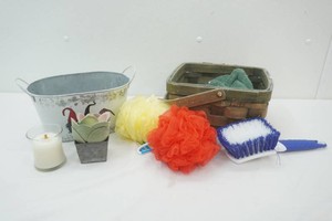 metal bucket and woven basket with cleaning scrubbies, scrub brush and more