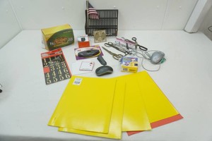 office supplies including file folders, rubber bands, scissors, mouse, mylar numbers and more