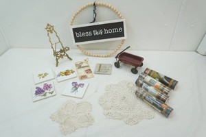 home decor including wall paper border roils, wall decor, miniature little red wagon, ceramic coasters