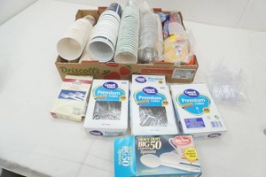 large assortment of reusable and disposable cups, forks and spoons