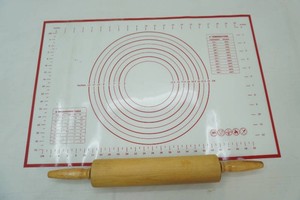 rolling pin and silicone pastry mat with printed measurement circles, ruler guides, and temp conversion guide