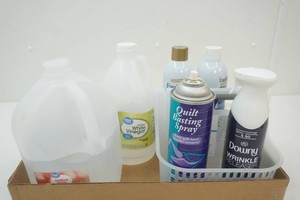 12 jug white vinegar and 12 jug distilled water, soft grip caddy with 2 cans ironing spray and quilt basting spray