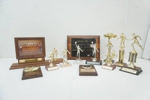 group of high school trophies from the late 1980s and early 1990s