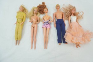 3 Barbies dated 1966, Ken dated 1967, 1 Barbie dated 1987