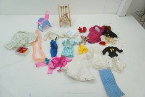 group of Barbie clothes and accessories