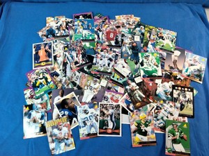 Assorted lot of 1990s NFL football trading cards from brands like Topps, Score, Pro Set, and Upper Deck