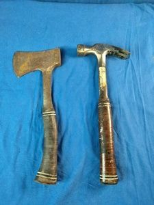 Vintage Estwing carpenters hatchet and a matching curved-claw hammer with stacked leather handles
