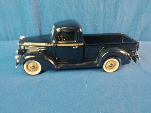 124 scale die-cast model of a 1938 Ford pickup truck, likely made by the Danbury Mint