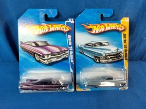 Two Hot Wheels die-cast carded cars