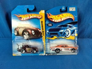 Two carded Hot Wheels die-cast cars from the 2010 New Models series