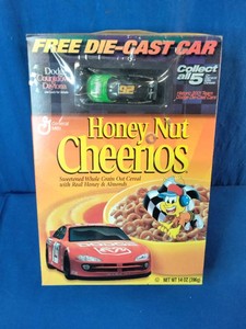 Vintage 2001 General Mills Honey Nut Cheerios cereal box featuring a promotional NASCAR Dodge die-cast car.