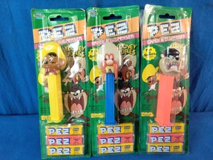 Three vintage, unopened Looney Tunes PEZ candy dispensers