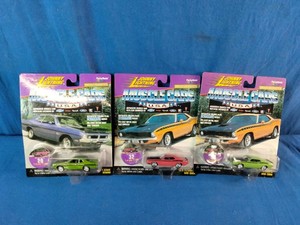 Three unopened 164 scale die-cast model cars from the Johnny Lightning Muscle Cars U.S.A. series,
