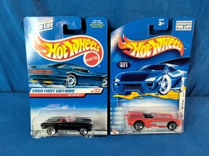 Two collectible Corvette Hot Wheels die-cast cars in their original blue blister packaging