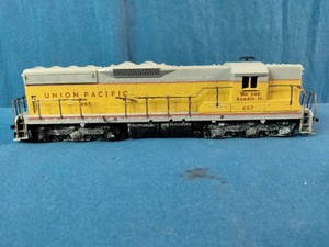 A vintage HO scale model diesel locomotive decorated in Union Pacific livery with road number 457