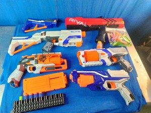 A collection of assorted Nerf blasters and accessories