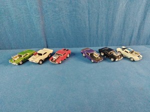 Acollection of six 164 scale cartoon-proportioned die-cast toy cars from the Muscle Machines series by Funline