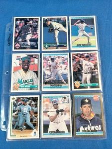 Nine vintage baseball cards featuring notable Major League Baseball players from the early 1990s in a plastic pocket sheet.