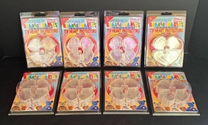 LR - Eight Packages of Ty Beanie Babies Heart Tag Protectors