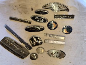 Lot of Automotive Badges and Emblems including Ram Laramie Longhorn Badge, Ford Emblems, and Great Lakes Edition Badge