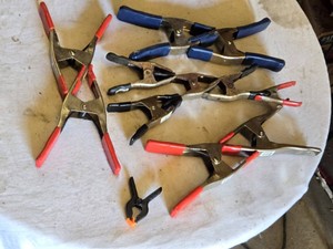 Spring clamps with red, blue, and black rubber grips