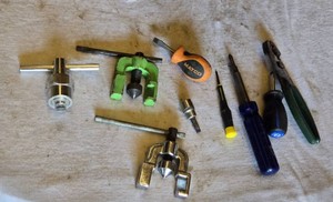 Assorted Hand Tools including Matco Driver, Flare Nut Wrench, Screwdrivers, and Pliers