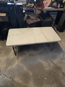 PDG 48-Inch Folding Table with adjustable height - at full height, one side sags