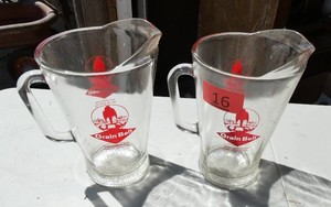 Two Grain Belt beer pitchers