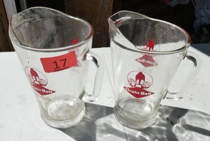 Two Grain Belt beer pitchers