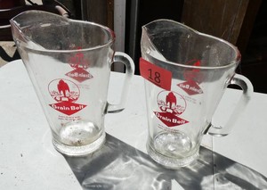 Two Grain Belt beer pitchers