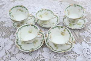Haviland 7 cups and 5 saucers