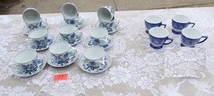 Group of blue and white cups and saucers