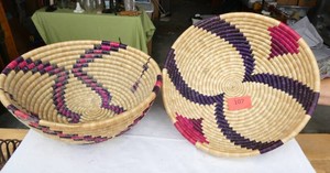 Two woven baskets each 13-12 inch diameter
