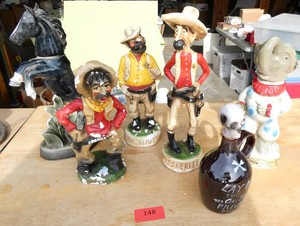 3 plaster cowboys and 3 decanters