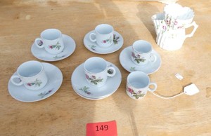 6 tea cups and saucers and a personal tea pot