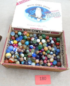 Cigar box of old marbles, includes a bunch of clay ones