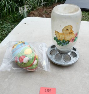 Baby chicken feeder and a cardboard easter egg