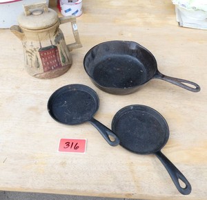 3 small cast iron pans and a vintage coffee pot